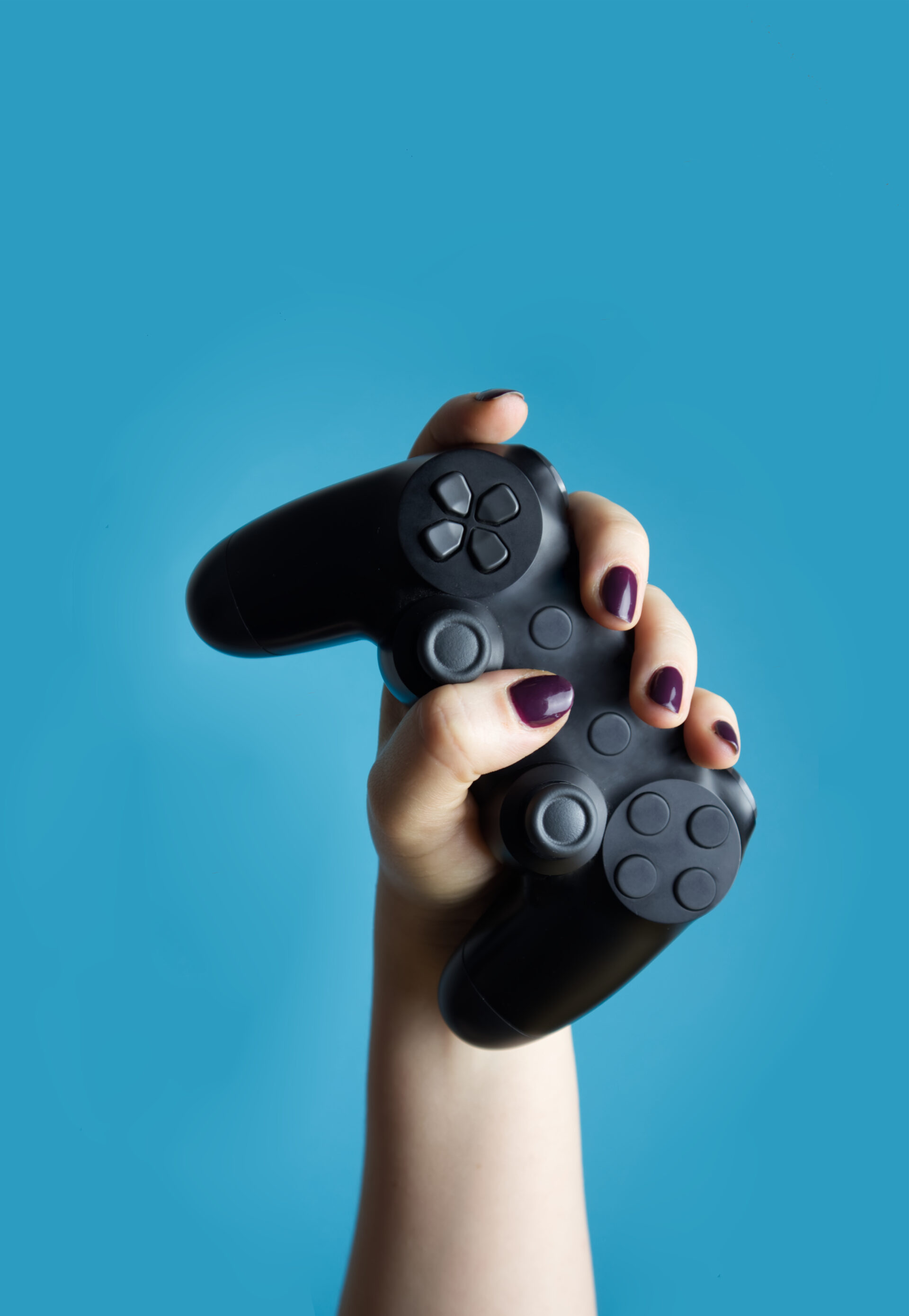 Repaired controller being held up by woman | Console repair in Dover completed by specialists at Why Not Fix